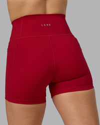 Woman wearing Fusion Ultra High-Rise 4" Short Pockets - Cherry Red | Model:Halle | Size:S | Thumbnail Index: 6