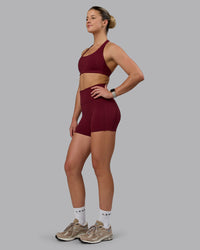 Woman wearing Fusion Ultra High-Rise 4" Short Pockets - Cordovan | Model:Chloe | Size:XS | Thumbnail Index: 5