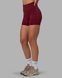 Woman wearing Fusion Ultra High-Rise 4" Short Pockets - Cordovan | Model:Chloe | Size:XS | Thumbnail Index: 6