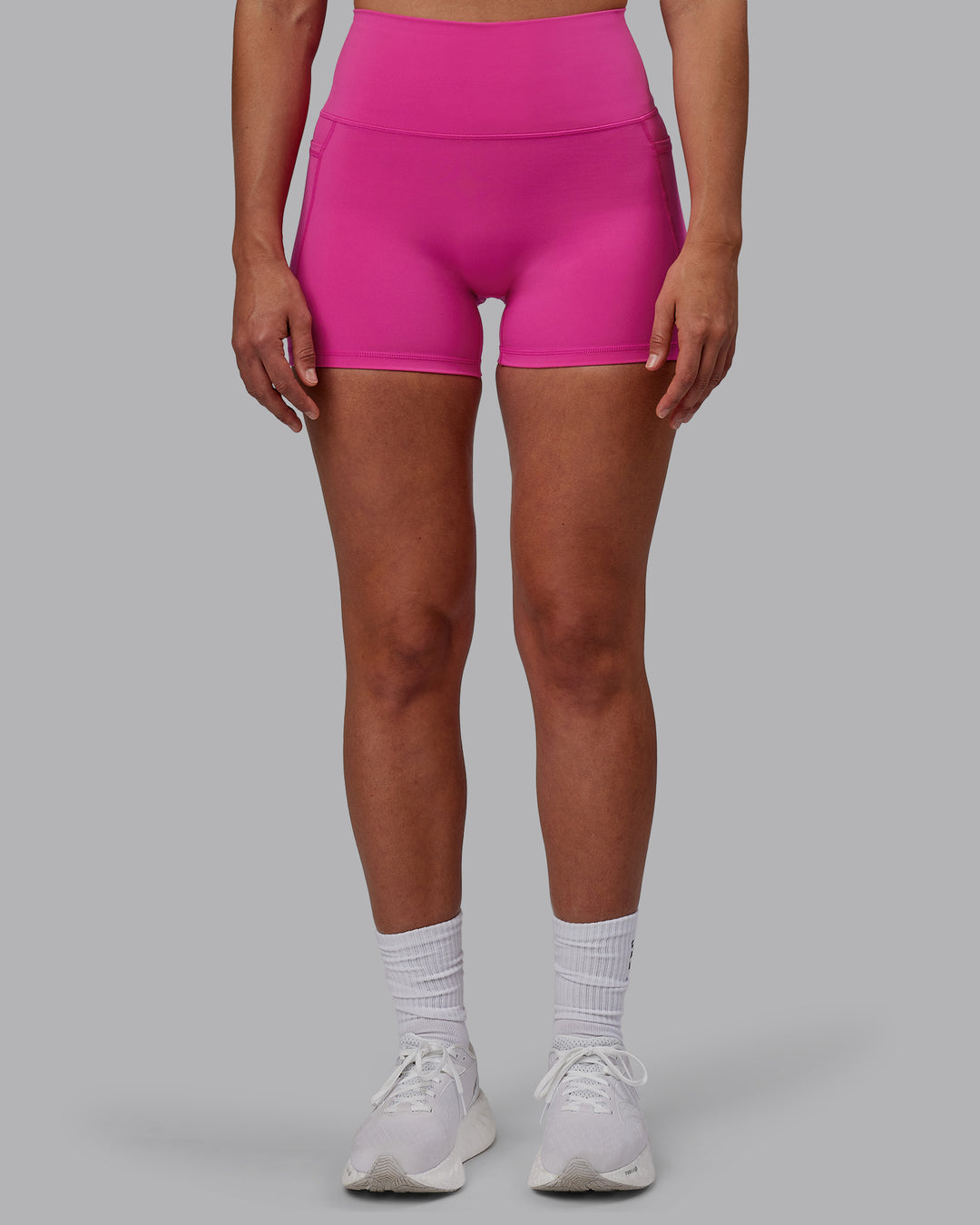 Woman wearing Fusion Ultra High-Rise 4" Short Pockets - Fuchsia Pink | Model:Sophie | Size:S - view 9
