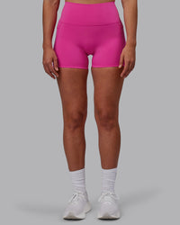 Woman wearing Fusion Ultra High-Rise 4" Short Pockets - Fuchsia Pink | Model:Sophie | Size:S | Thumbnail Index: 8