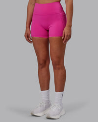 Woman wearing Fusion Ultra High-Rise 4" Short Pockets - Fuchsia Pink | Model:Sophie | Size:S | Thumbnail Index: 5
