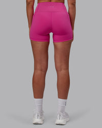 Woman wearing Fusion Ultra High-Rise 4" Short Pockets - Fuchsia Pink | Model:Sophie | Size:S | Thumbnail Index: 2