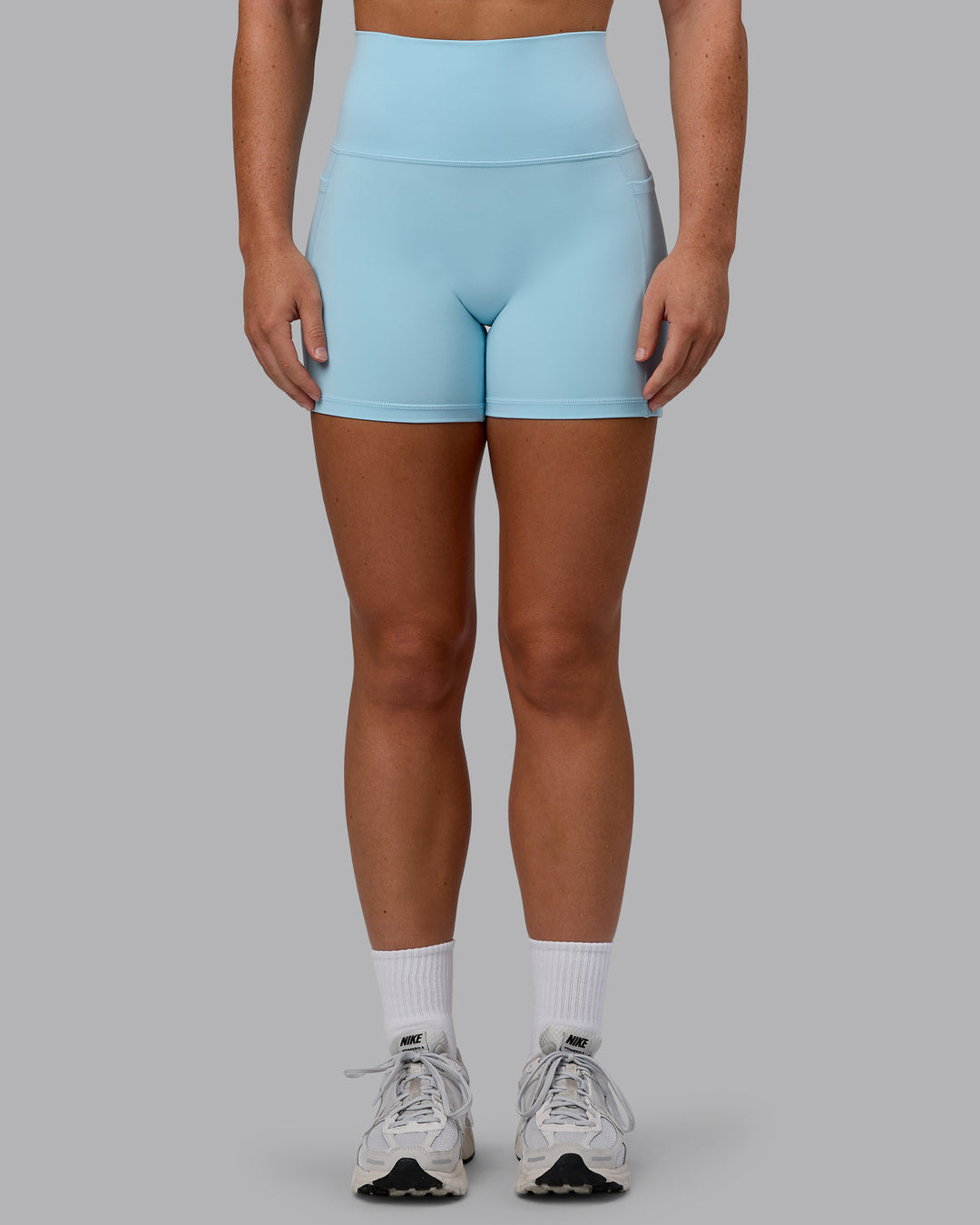 Woman wearing Fusion Ultra High-Rise 4" Short Pockets - Glacial Blue | Model:Monique | Size:S - view 10