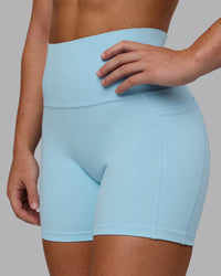 Woman wearing Fusion Ultra High-Rise 4" Short Pockets - Glacial Blue | Model:Monique | Size:S | Thumbnail Index: 5