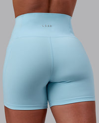 Woman wearing Fusion Ultra High-Rise 4" Short Pockets - Glacial Blue | Model:Monique | Size:S | Thumbnail Index: 8
