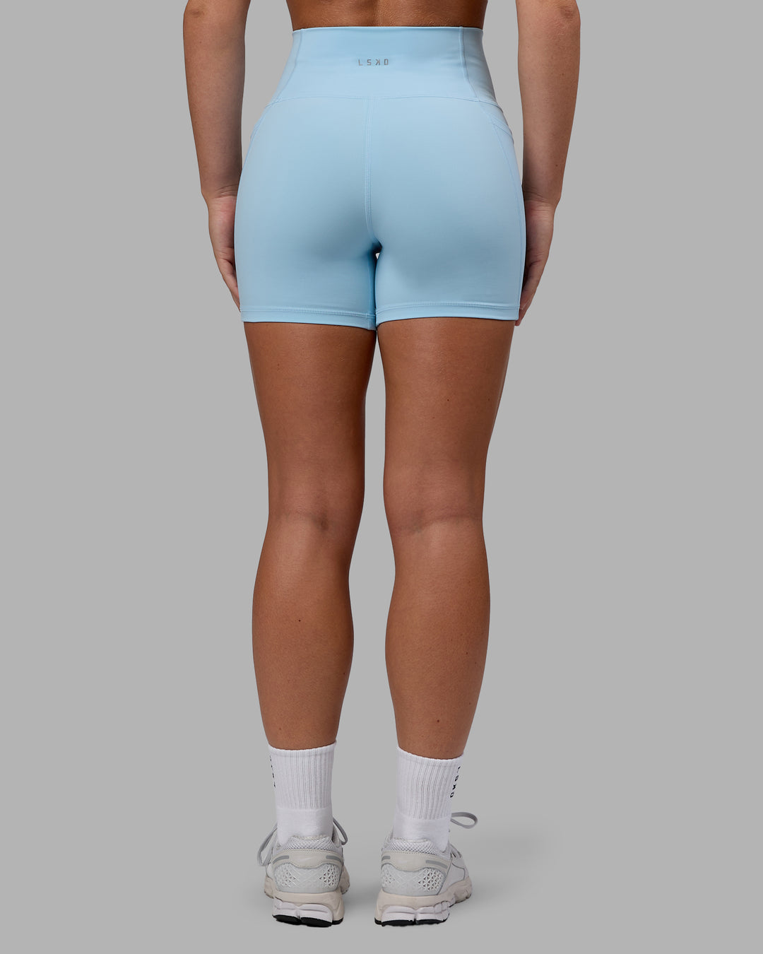Woman wearing Fusion Ultra High-Rise 4" Short Pockets - Glacial Blue | Model:Monique | Size:S - view 5