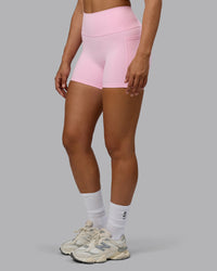 Woman wearing Fusion Ultra High-Rise 4" Short Pockets - Pale Pink | Model:Sophie | Size:S | Thumbnail Index: 5