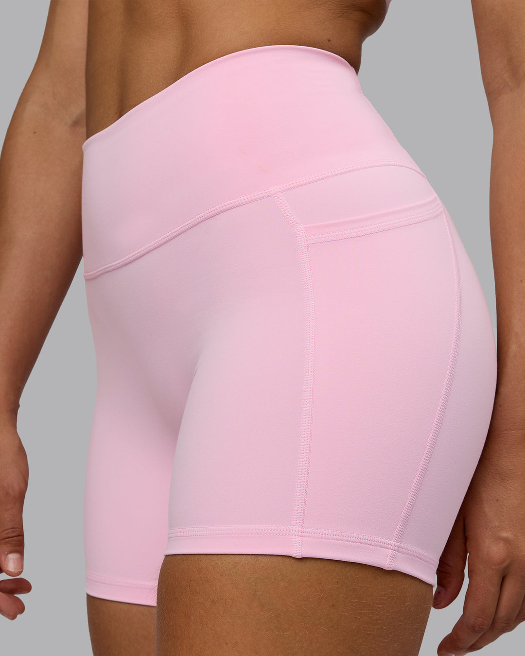 Woman wearing Fusion Ultra High-Rise 4" Short Pockets - Pale Pink | Model:Sophie | Size:S - view 7