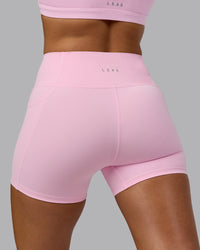 Woman wearing Fusion Ultra High-Rise 4" Short Pockets - Pale Pink | Model:Sophie | Size:S | Thumbnail Index: 7