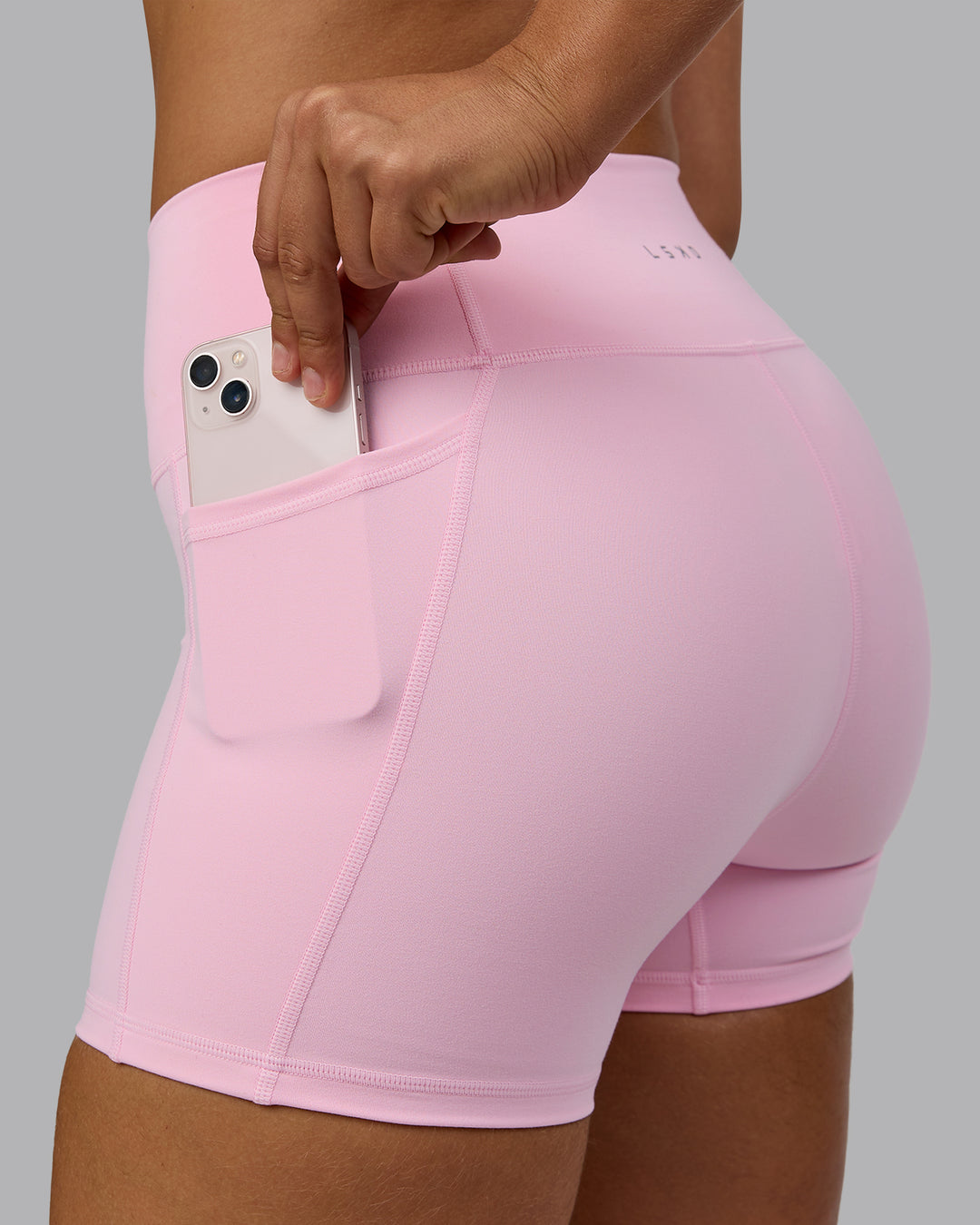 Woman wearing Fusion Ultra High-Rise 4" Short Pockets - Pale Pink | Model:Sophie | Size:S - view 5