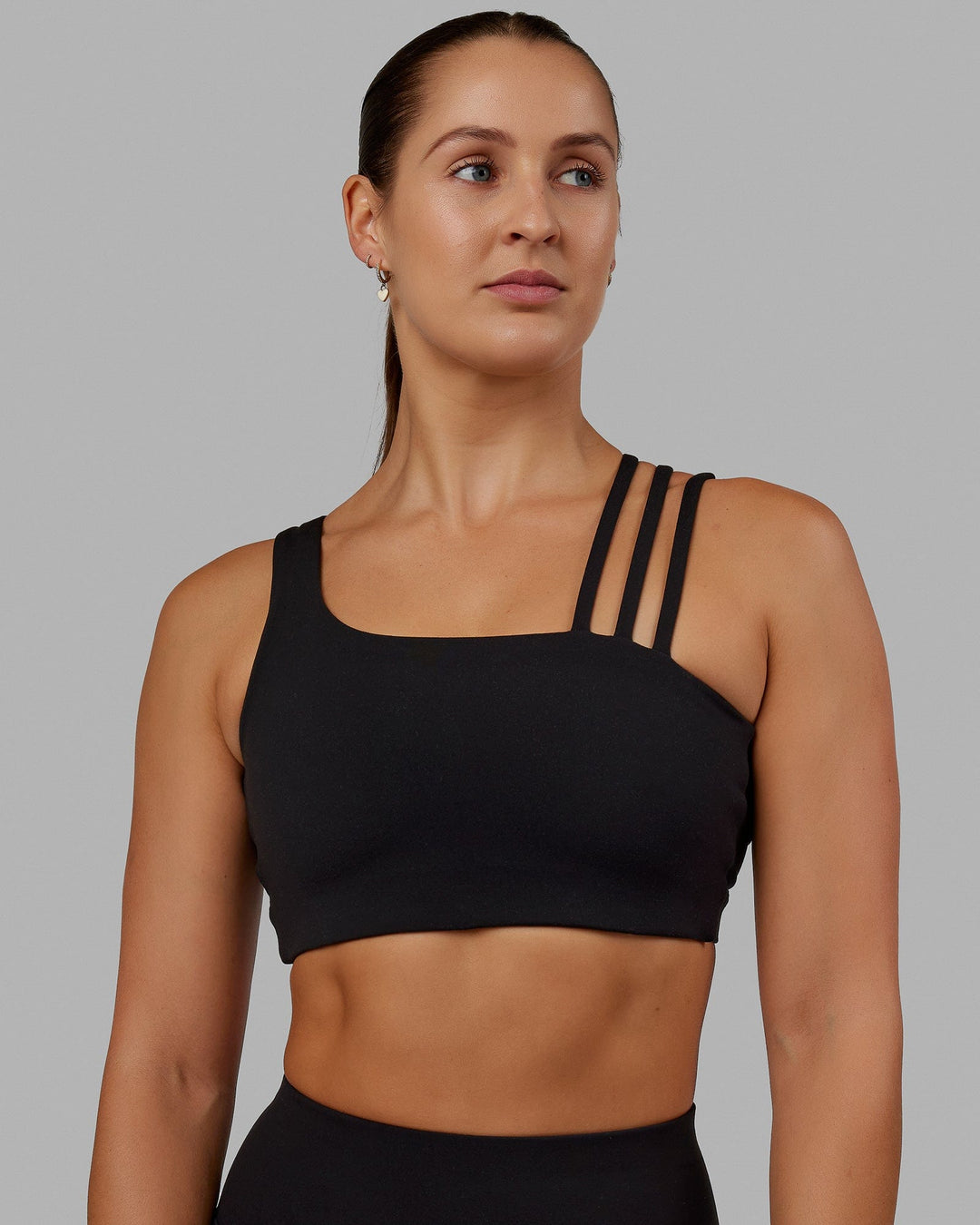 Woman wearing Galvanise Sports Bra - Black - view 2