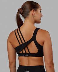 Woman wearing Galvanise Sports Bra - Black | Thumbnail Index: 0
