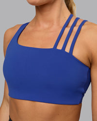 Woman wearing Galvanise Sports Bra - Power Cobalt | Thumbnail Index: 6