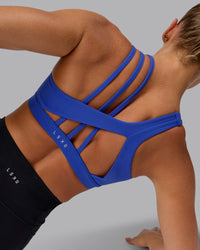 Woman wearing Galvanise Sports Bra - Power Cobalt | Thumbnail Index: 0