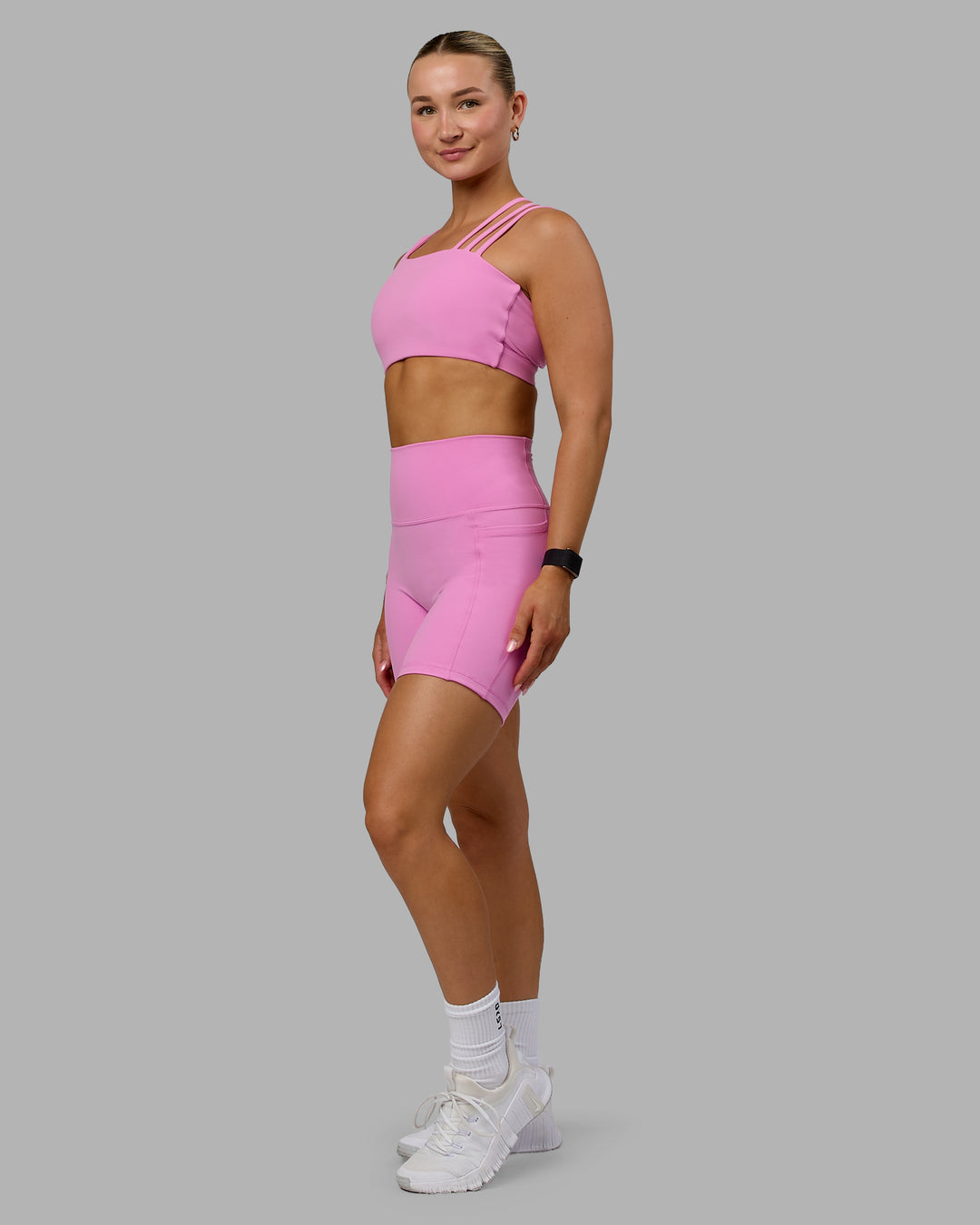 Woman wearing Galvanise Sports Bra - Spark Pink - view 3