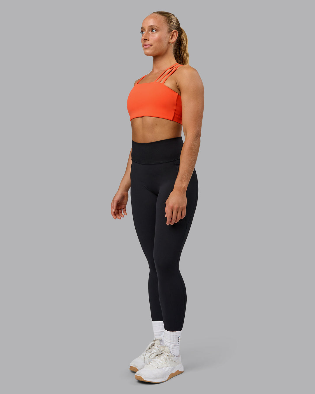 Woman wearing Galvanise Sports Bra - Ultra Orange - view 7