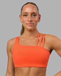 Woman wearing Galvanise Sports Bra - Ultra Orange | Thumbnail Index: 0