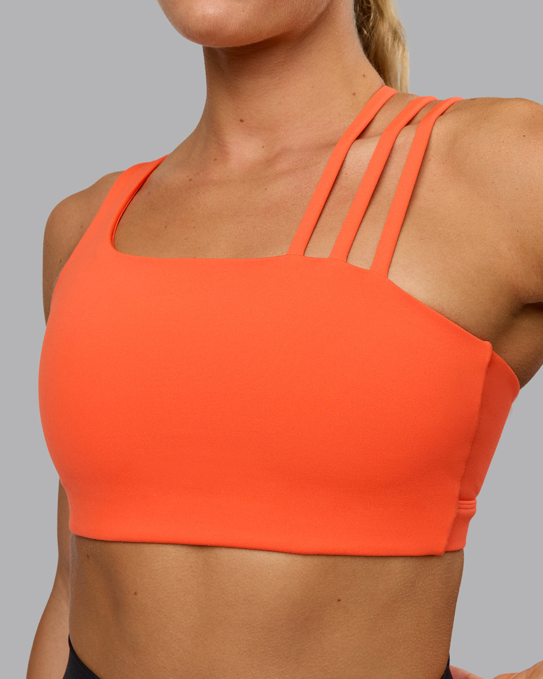 Woman wearing Galvanise Sports Bra - Ultra Orange - view 6