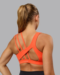 Woman wearing Galvanise Sports Bra - Ultra Orange | Thumbnail Index: 7