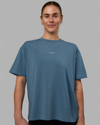 Woman wearing Go-To FLXCotton Oversized Tee - Elemental Blue-White | Thumbnail Index: 1