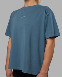 Woman wearing Go-To FLXCotton Oversized Tee - Elemental Blue-White | Thumbnail Index: 4