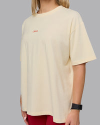 Woman wearing Go-To FLXCotton Oversized Tee - Ivory-Cherry Red | Thumbnail Index: 4