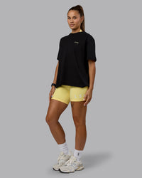 Woman wearing Go-To We Rise FLXCotton Oversized Tee - Black-Glacial Blue | Thumbnail Index: 2