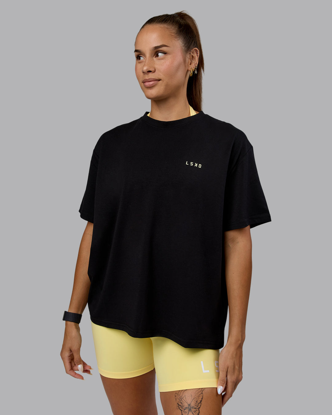 Woman wearing Go-To We Rise FLXCotton Oversized Tee - Black-Glacial Blue - view 2