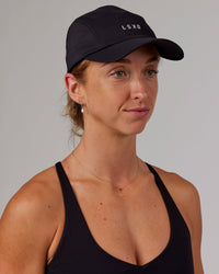 Woman wearing Hybrid Performance Cap - Black | Thumbnail Index: 5