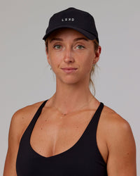 Woman wearing Hybrid Performance Cap - Black | Thumbnail Index: 7