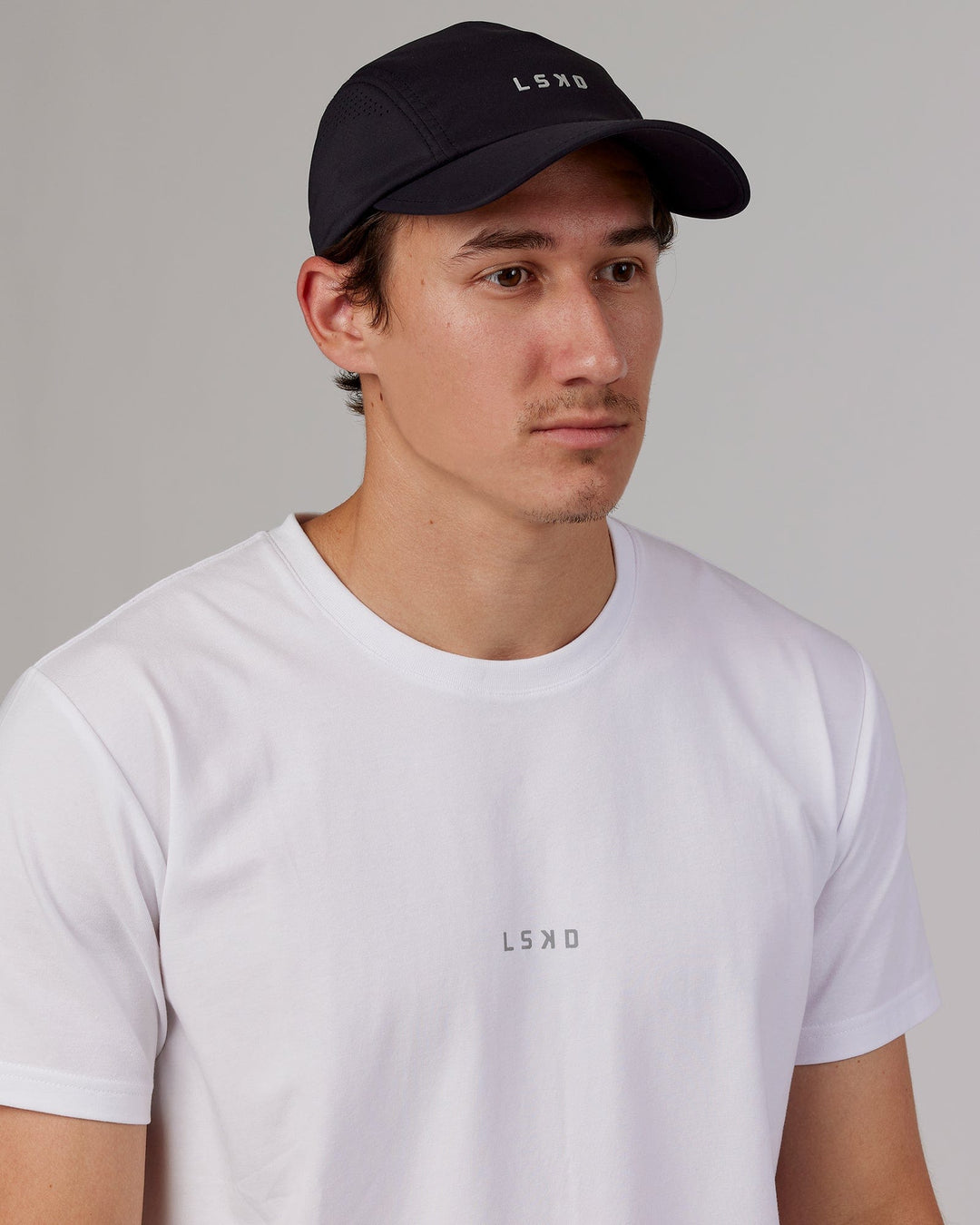 Man wearing Hybrid Performance Cap - Black - view 1