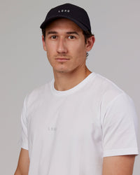 Man wearing Hybrid Performance Cap - Black | Thumbnail Index: 6