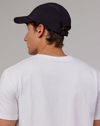 Man wearing Hybrid Performance Cap - Black | Thumbnail Index: 2