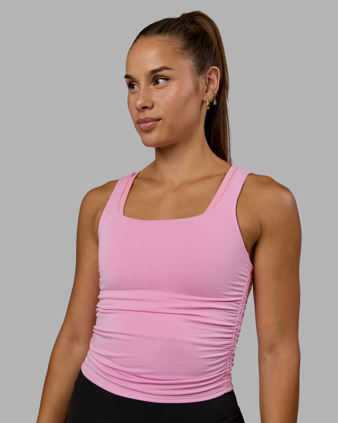 Woman wearing Ignite Scrunch Side Tank - Bubblegum - view 1