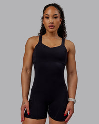 Woman wearing Inertia Bodysuit - Black | Thumbnail Index: 4