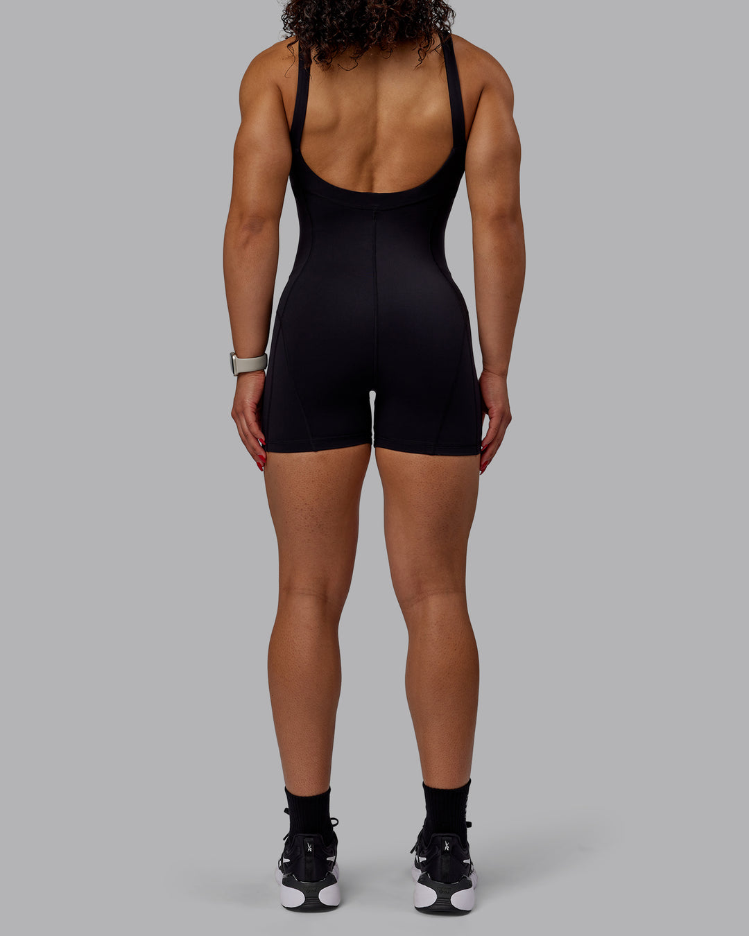 Woman wearing Inertia Bodysuit - Black - view 7