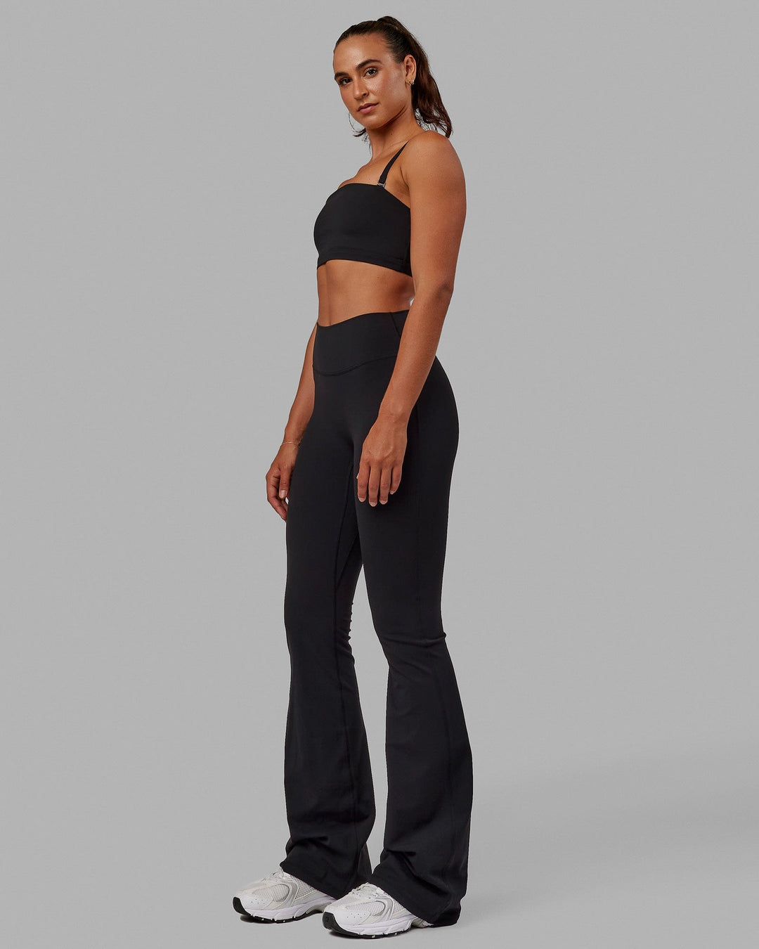 Woman wearing Inspire Sports Bra - Black - view 5