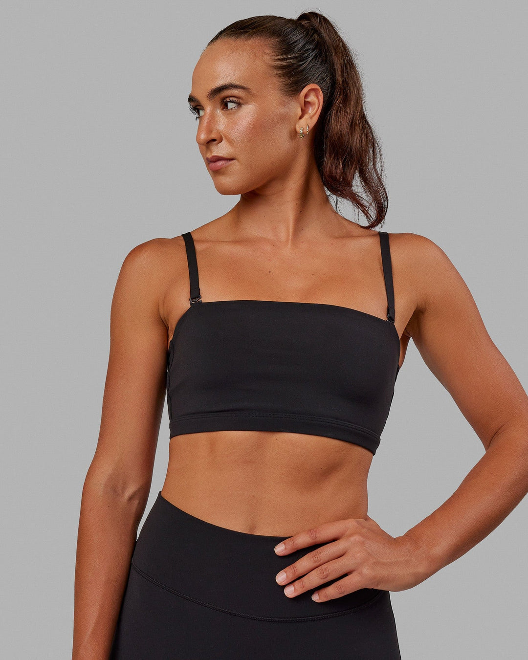 Woman wearing Inspire Sports Bra - Black - view 3
