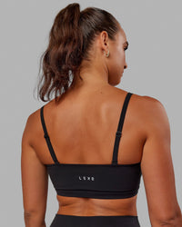 Woman wearing Inspire Sports Bra - Black | Thumbnail Index: 7