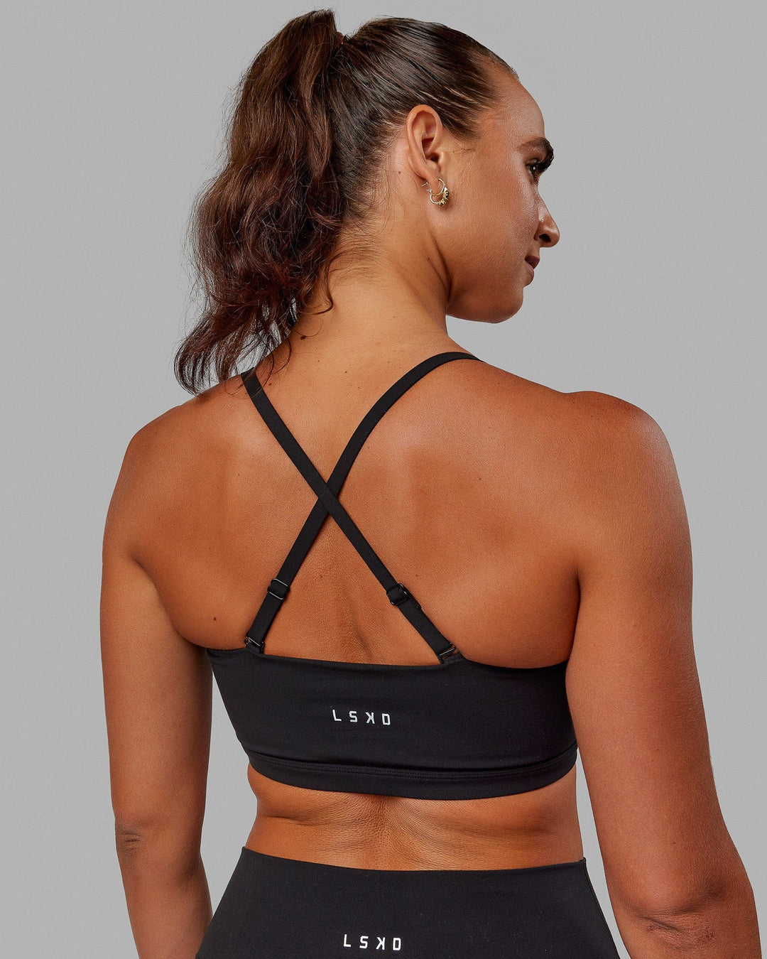 Woman wearing Inspire Sports Bra - Black - view 4