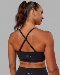 Woman wearing Inspire Sports Bra - Black | Thumbnail Index: 3