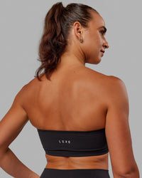 Woman wearing Inspire Sports Bra - Black | Thumbnail Index: 1