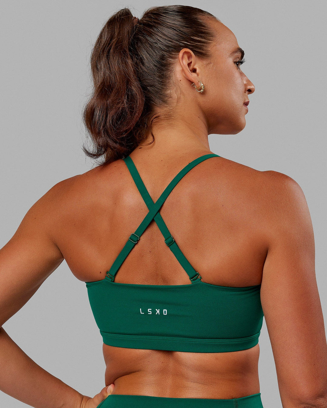 Woman wearing Inspire Sports Bra - Malachite - view 10