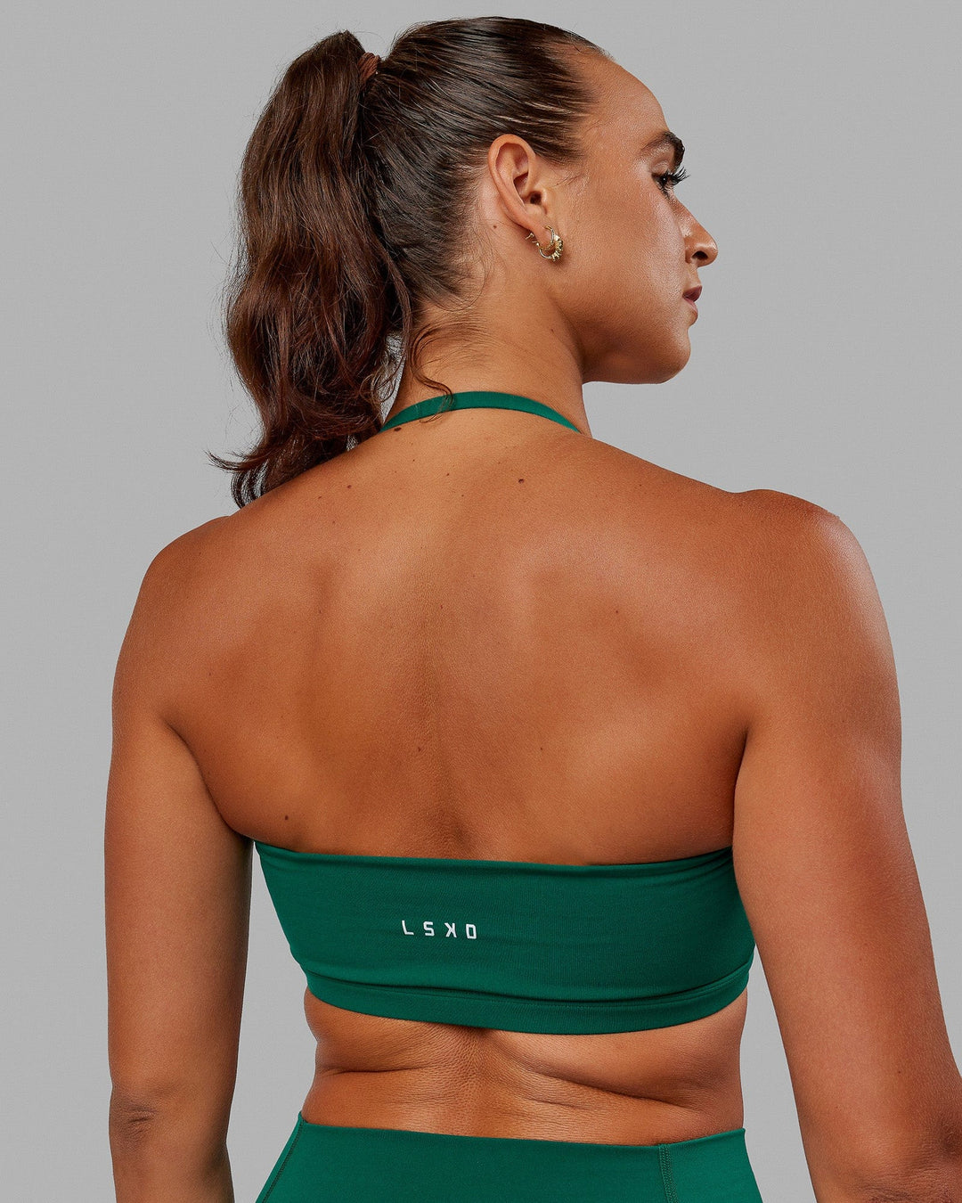 Woman wearing Inspire Sports Bra - Malachite - view 4