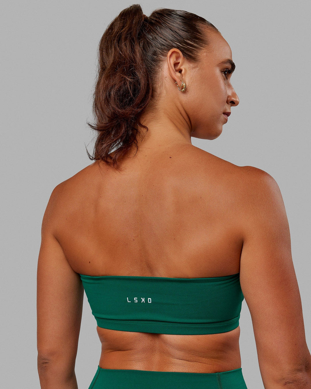 Woman wearing Inspire Sports Bra - Malachite - view 7