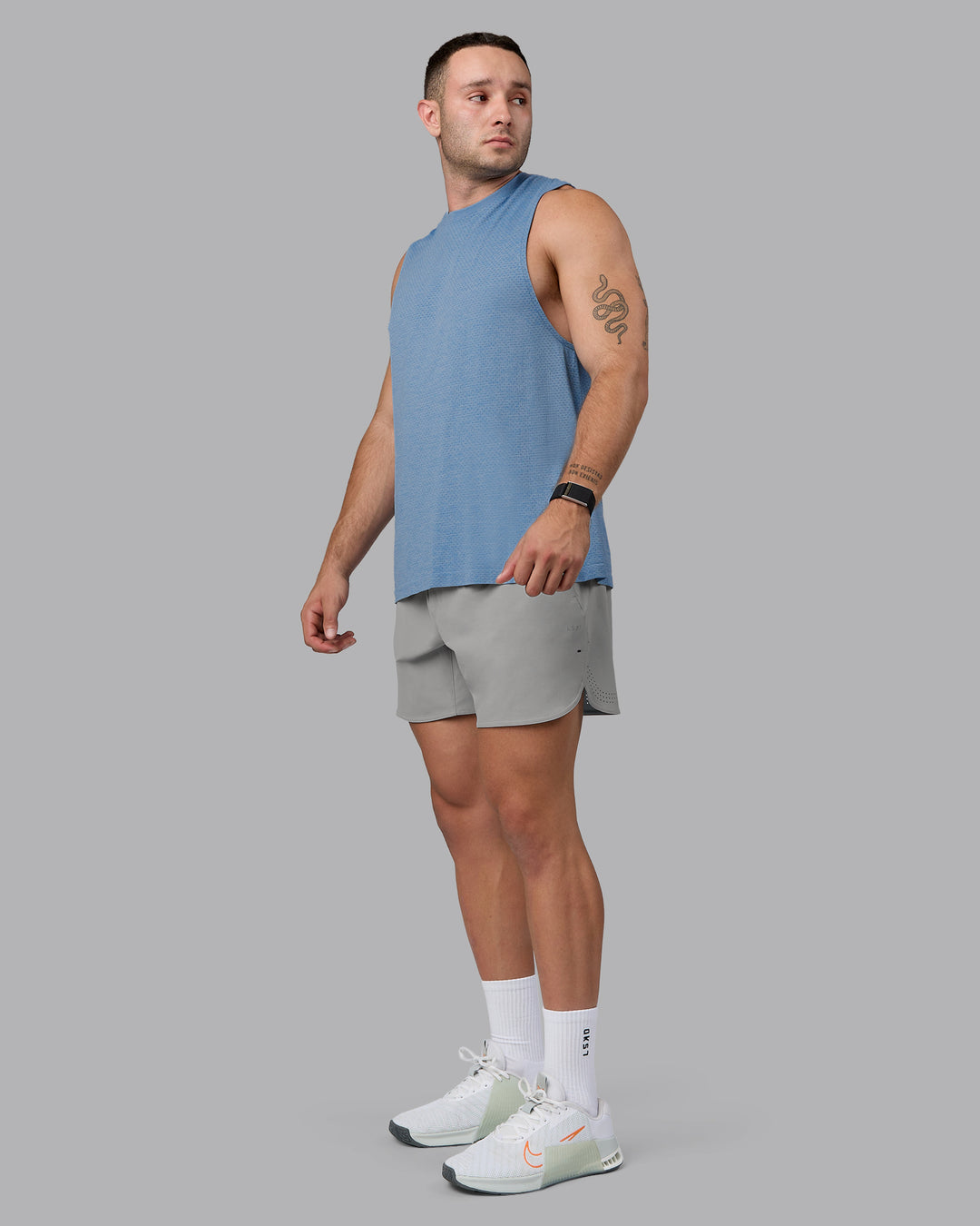 Man wearing Lift 6" Lined Performance Shorts - Circular Grey - view 3