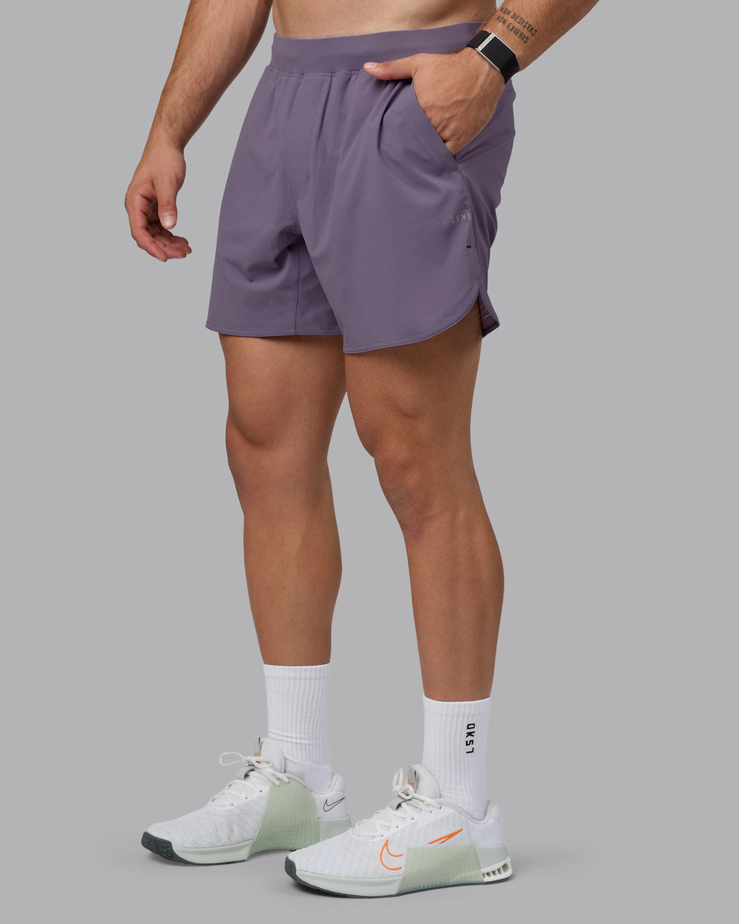 Man wearing Lift 6" Lined Performance Shorts - Purple Sage - view 1