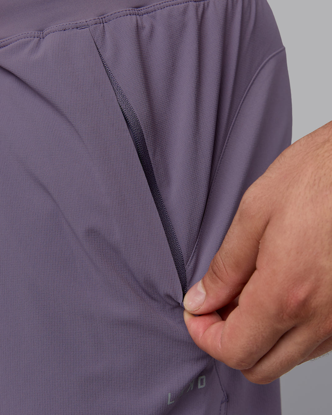 Man wearing Lift 6" Lined Performance Shorts - Purple Sage - view 7