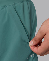 Man wearing Lift 6" Lined Performance Shorts - Sagebrush | Thumbnail Index: 5